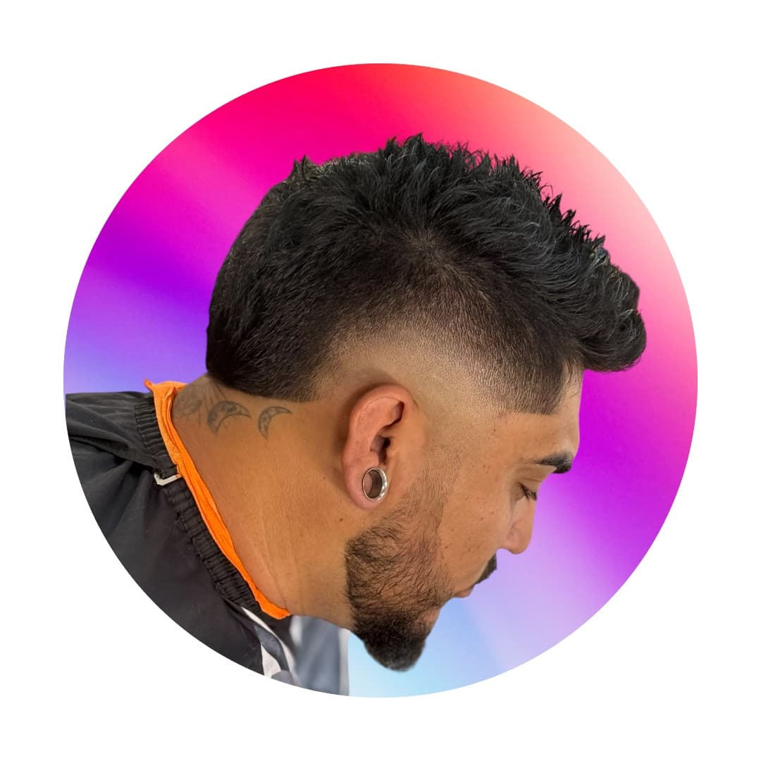 Burst fade with textured length on top, styled at Tu Barber Cubanito